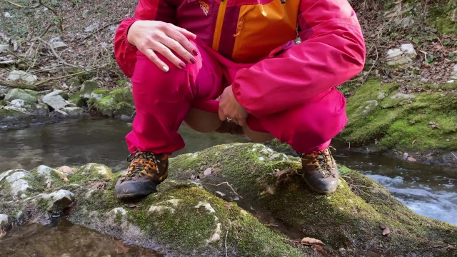 My GF peeing inside a river