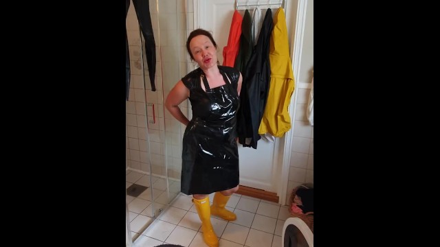 Trying on raincoats into latex boots - huge boobs