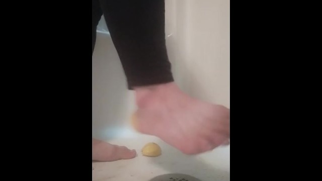 Steps on lemons into shower, grinds it inside