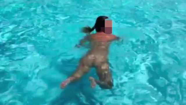 swimming nude inside the pool showing boobies and butt