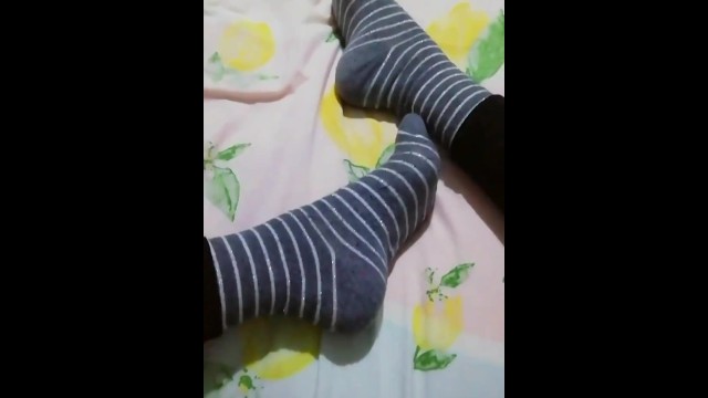 Foot Inside Grey Socks, Legs Into Ebony Pants