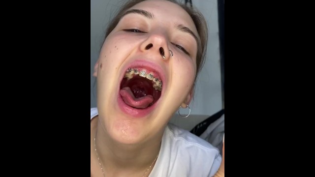 Gigantess with braces chews her tinys