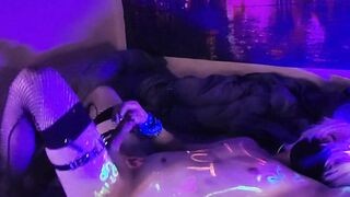 Slutty femboy makes a mess with his cum under african lights!