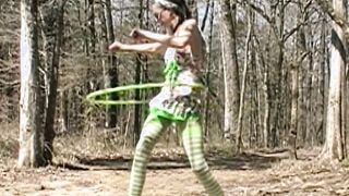 Milf inside swimsuit plays with Hula Hoop