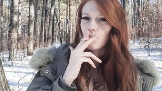 red haired smokes into the forest