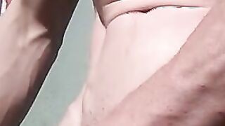 Stroking cock in sunshine