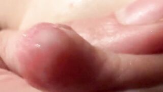 Female breast milk and nipple close up