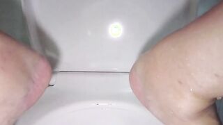 Very long close up pee on bathroom